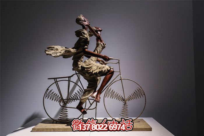 創(chuàng)意不銹鋼騎自行車(chē)人物雕塑
